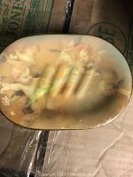 Top view of the angelic soap dish showing cherubic figures and soap grooves.