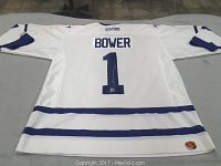 Full back view of white CCM Toronto Maple Leafs jersey with blue trim, name BOWER and number 1