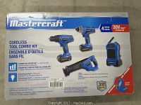 Front of Mastercraft tool combo kit box showing illustrations of drill, impact driver, saw and radio