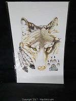Full view of the native art print showing wolf head, feathers, and paw prints.