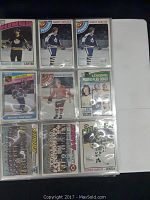 Photo showing 9 hockey cards including Marcel Dionne, Randy Carlyle, Wayne Gretzky, Doug Wilson, Dennis Maruk and leader stat cards