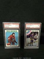 Two graded hockey cards in PSA slabs: 1975 Topps Jim Rutherford GEM MT 10 on left, 1978 O-Pee-Chee Dave Taylor NM 7 on right