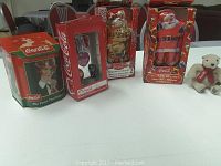 Photo showing all items in the lot including collectible box, playing card sets, ornament boxes, and teddy bear