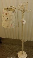 Full view of the vintage floor lamp showing the patterned modern shade and base.