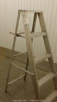 Full side view of the 5 ft aluminum ladder showing overall structure and steps.