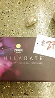 Closed box of ZUMBA Exhilarate fitness DVD set on floor showing brand and set name.