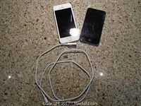 Two Apple devices - iPhone 5 and iPod Touch with charging cable on granite surface