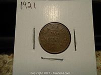 Reverse side of the 1921 Canadian One Cent coin in holder showing denomination, date, and maple leaves design.