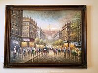 Full frontal photo of the framed oil painting showing Paris street scene with Eiffel Tower at center background. Large rustic frame visible.