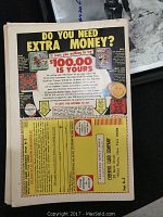 Back cover of one of the comic books showing an advertisement and yellowed paper indicating vintage condition.