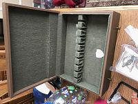 Empty felt-lined wooden box with compartments for storage or display