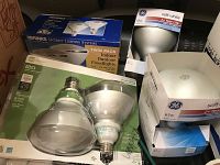 Two boxes of assorted light bulbs including Brinks twin pack indoor/outdoor floodlights, GE soft white bulbs in boxes and loose.