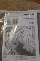Photo of Panasonic operational instruction manual for SC-PM18 and SC-PM16 CD stereo systems.
