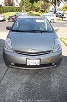 Front view of 2004 Prius showing silver metallic hood, grille, lighting and California license plate 5ESB088.