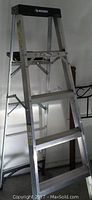 Full view of the aluminum Husky A-frame ladder showing its structure and steps.