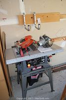 Craftsman 10-inch table saw with extension cord coiled on top and Skil saw placed on surface