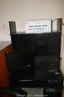 Black Asus VE228 LCD monitor, Acer media bay desktop computer, Samsung ML-2545 printer on black shelving unit.