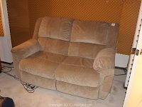 Front view of taupe suede loveseat couch showing plush cushions, suede texture, and padded armrests.
