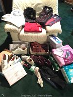 Lot overview with 16 men's collared shirts stacked, and shoes in boxes and pairs scattered on floor and chair