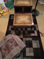 Overview of end tables on rugs with stool nearby