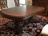 Full table view showing oval top, pedestals and one leaf seam