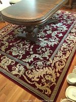 Palazzo area rug under dining table showcasing overall pattern and color.