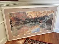 Full view of the large framed landscape art print showing river and trees in pastel colors.