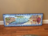 Full view of the hand painted tile landscape showing the Amalfi Coast with detailed buildings and sea.