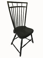 Black painted Windsor chair with duckbill birdcage style backrest and contoured seat shown from side angle.