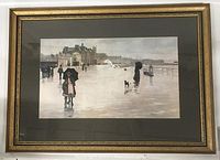 Framed print artwork "The Rain It Raineth Every Day" showing rainy street scene with people and dog on reflective wet pavement, mounted under glass with a decorative gold frame and a dark mat.