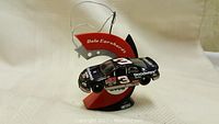 Side view of Dale Earnhardt diecast car mounted on a red and black display stand