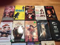 Top view of VHS tapes showing titles Dirty Dancing, Don't Some Waiting, Moulin Rouge, They Finally Deep, Evita, and more.