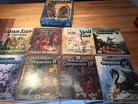 Photo of Rolemaster core rules and companion books including Arms Law, Character Law & Campaign Law, Spell Law, and multiple Rolemaster Companion volumes I through IV.