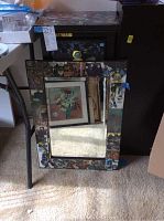 Full view of Batman-themed mirror resting on floor showing comic panels border.