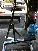 Full view of CCM stepper machine showing black foot pedal, metal frame