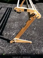 Close-up of one side leg of the pine quilting frame showing construction details and screws.