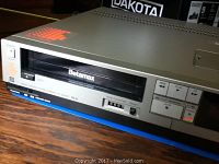 Front view showing loaded Betamax tape slot and basic control buttons