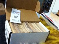Box of OPC hockey cards from 1978-79 set, showing top view of cards inside box with label number 63.