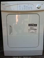 Front view of white Samsung apartment size front-loading electric clothes dryer with door and Energy Guide label.
