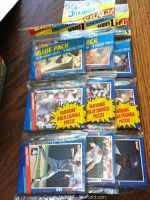 Multiple unopened and opened 1991 Donruss Baseball Series 1 baseball puzzle card packs displayed with some loose cards visible.