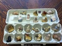 Overview photo of 24 miniature figurines arranged in a repurposed egg carton