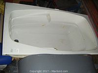 Full view of white whirlpool bathtub showing the interior, jets, and overall condition.