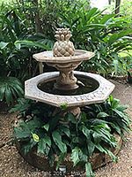Full view of assembled three-tier fountain on patio base (built-in basin not included).