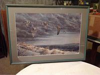 Framed print of geese flying over water, primarily gray/blue tones, 35" x 25"