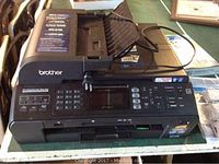 Full view of Brother MFC-5895 all-in-one inkjet printer showing control panel keypad, LCD screen, and automatic document feeder on top.