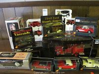 Multiple boxed die cast car models displayed together