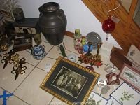 Wide angle showing all lot contents including vintage photo, pottery vase, brass lighting, stained glass, and decorative boxes.