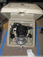 Craftsman router model 315.17360 inside its beige hard plastic case with carry handle, showing the entire router and case.