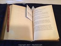 Open Twin Lock binder showing typed military and administrative entries on loose-leaf pages concerning special orders for 'Indians' discharge and return to reserves.