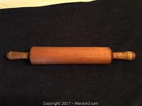 Full view of 18" solid maple rolling pin showing handles and rolling surface.